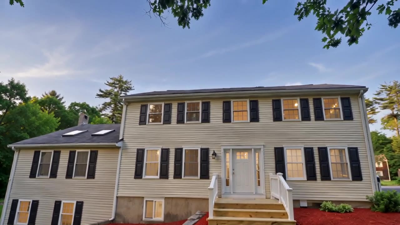 The front of 1126 Plymouth St, a renovated Colonial with black shutters
